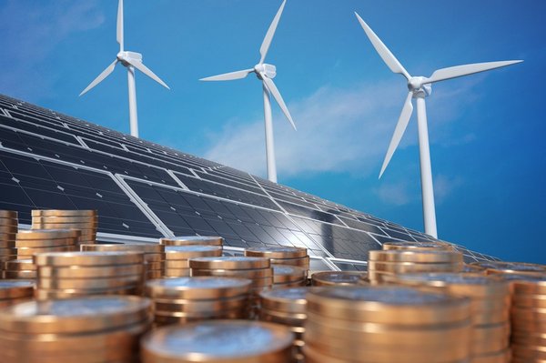 wind turbines, solar panels, and coins framed by a clear blue sky behind it