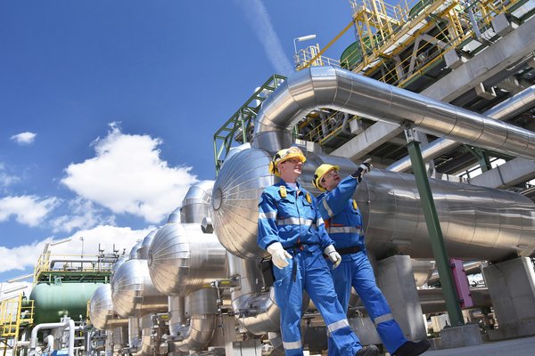 An oil refinery with workers.