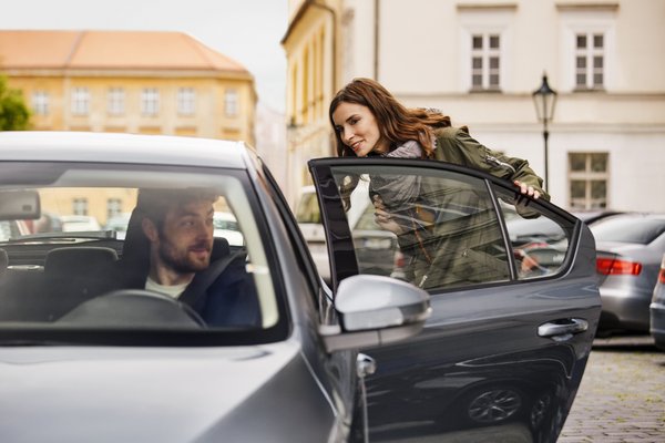 Passenger gets into an Uber.